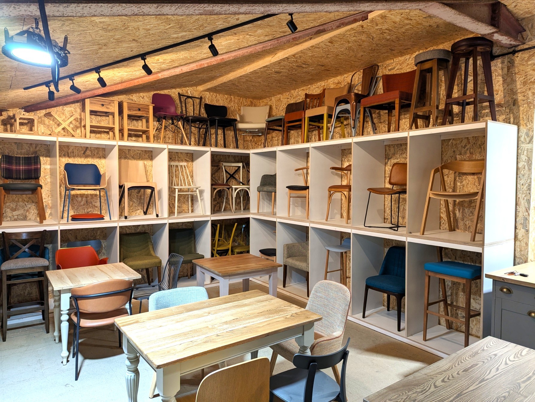 Timber tables and loose furniture in a commercial dining space